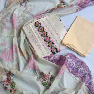 A beautifully arranged floral and geometric patterned fabric set on a flat surface, showcasing intricate designs.
